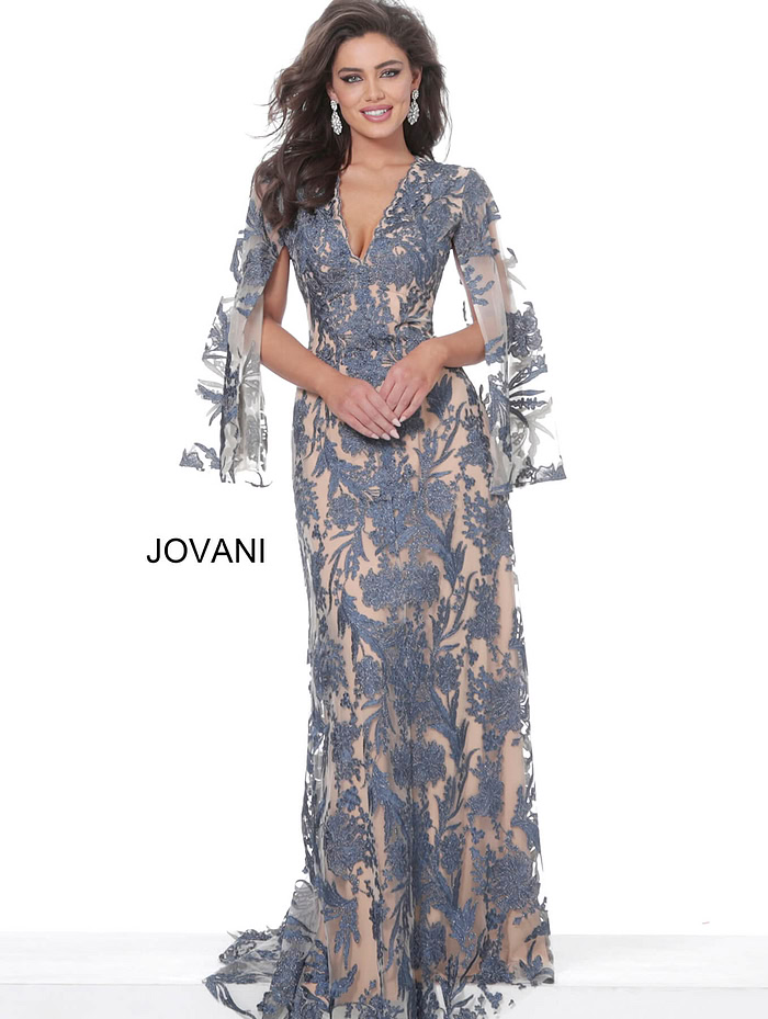 model wearing Jovani 00752 navy A-line gown with floral embroidery and bell sleeves
