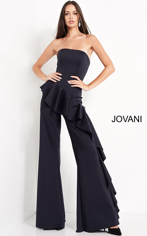 Model wearing Jovani 00778 with a strapless neckline and ruffled detailing in navy.