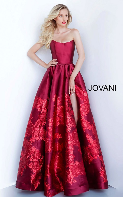 Model wearing Jovani 02038 elegant ball gown with floral embroidery and high slit.