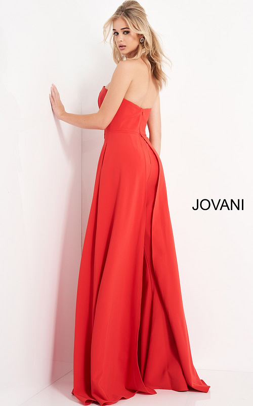 Model wearing Jovani 03529 red jumpsuit, back view, emphasizing the strapless design and flow of the wide-leg cut.