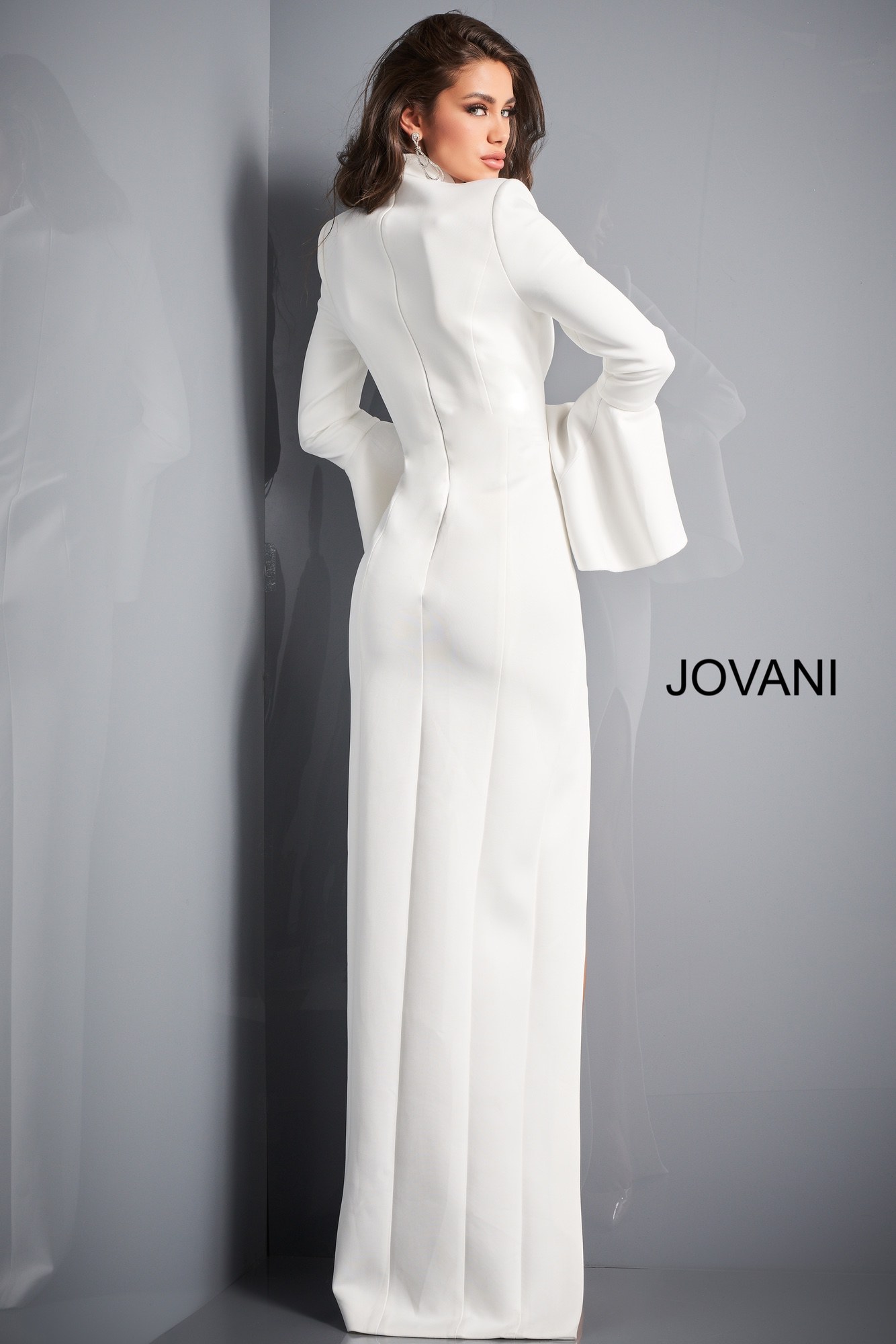 Back view of model in Jovani 04240 white gown with fitted silhouette.