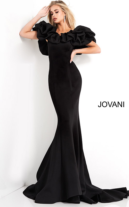 Model wearing Jovani 04368 black mermaid gown with ruffled sleeves, front view.