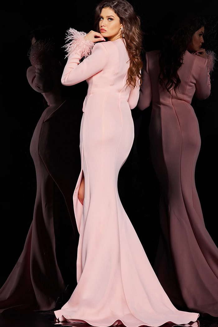 back view of model in Jovani 04501 blush gown featuring high slit