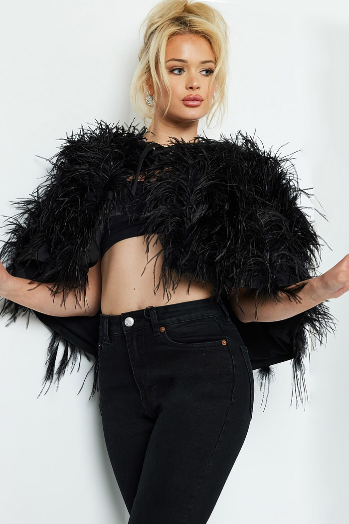 Model showcasing Jovani 05257 dress in black with elegant detailing.