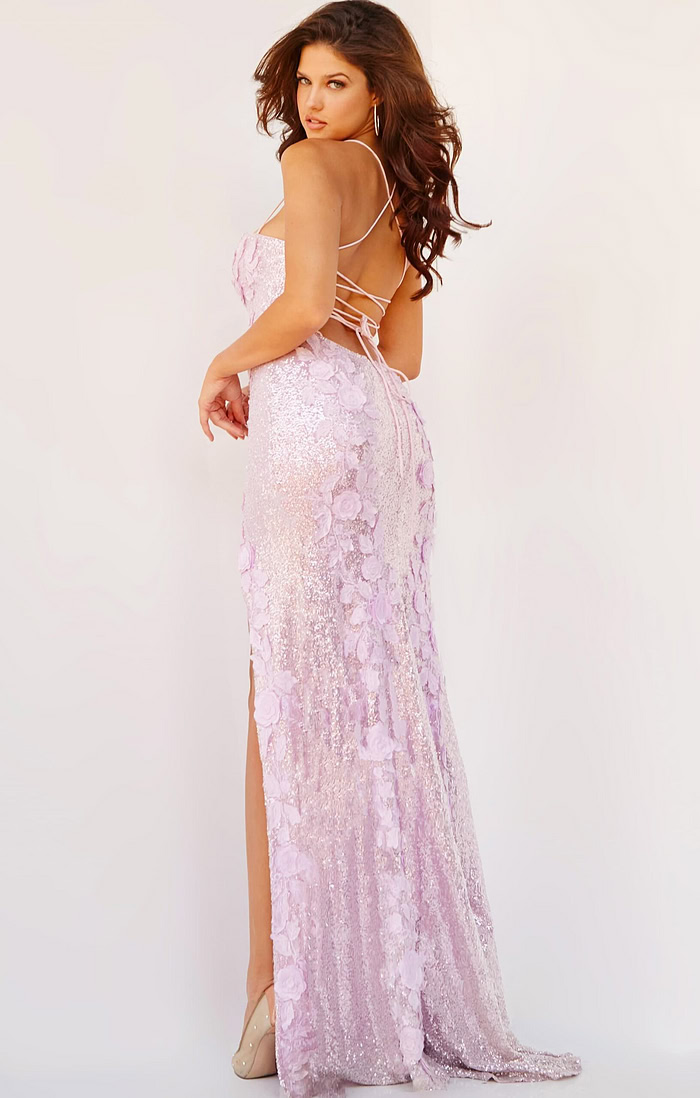 model wearing 06109 ice pink gown with open back and tied lace-up detail