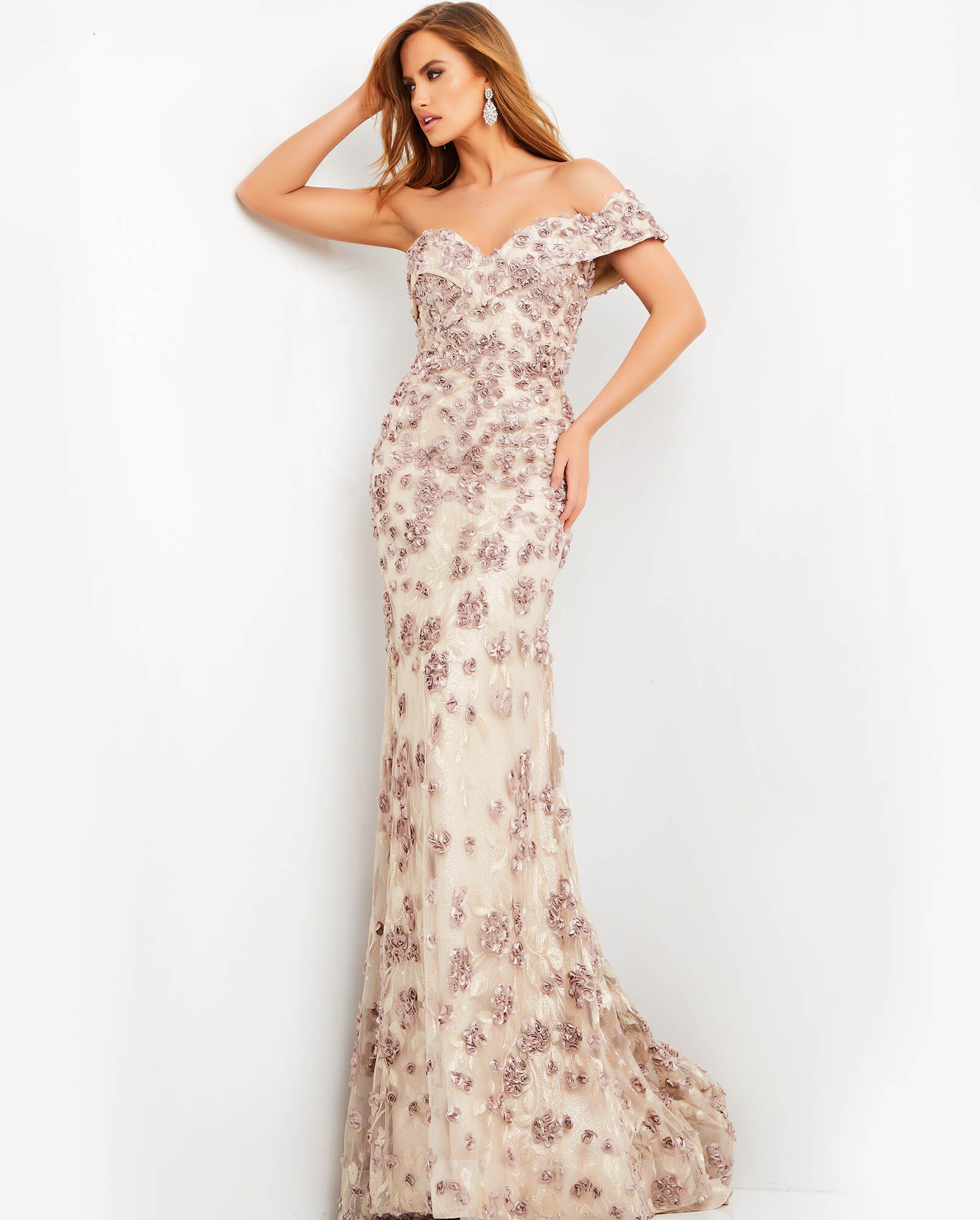 Model wearing Jovani 06169 cafe gown with off-shoulder neckline and lace appliques.