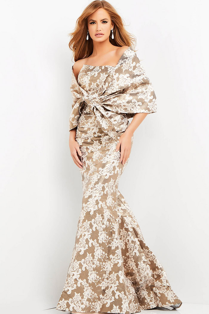 Model wearing Jovani 06760 beige mermaid dress with off-the-shoulder neckline.