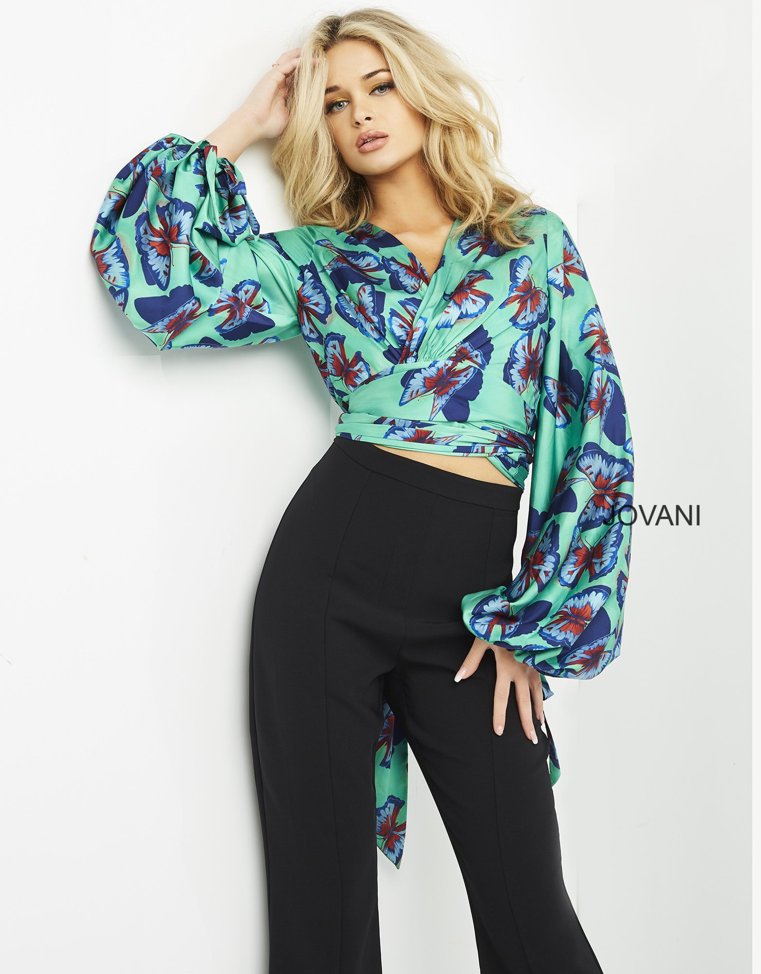 model wearing Jovani 06844 Print top with butterfly print and long sleeves