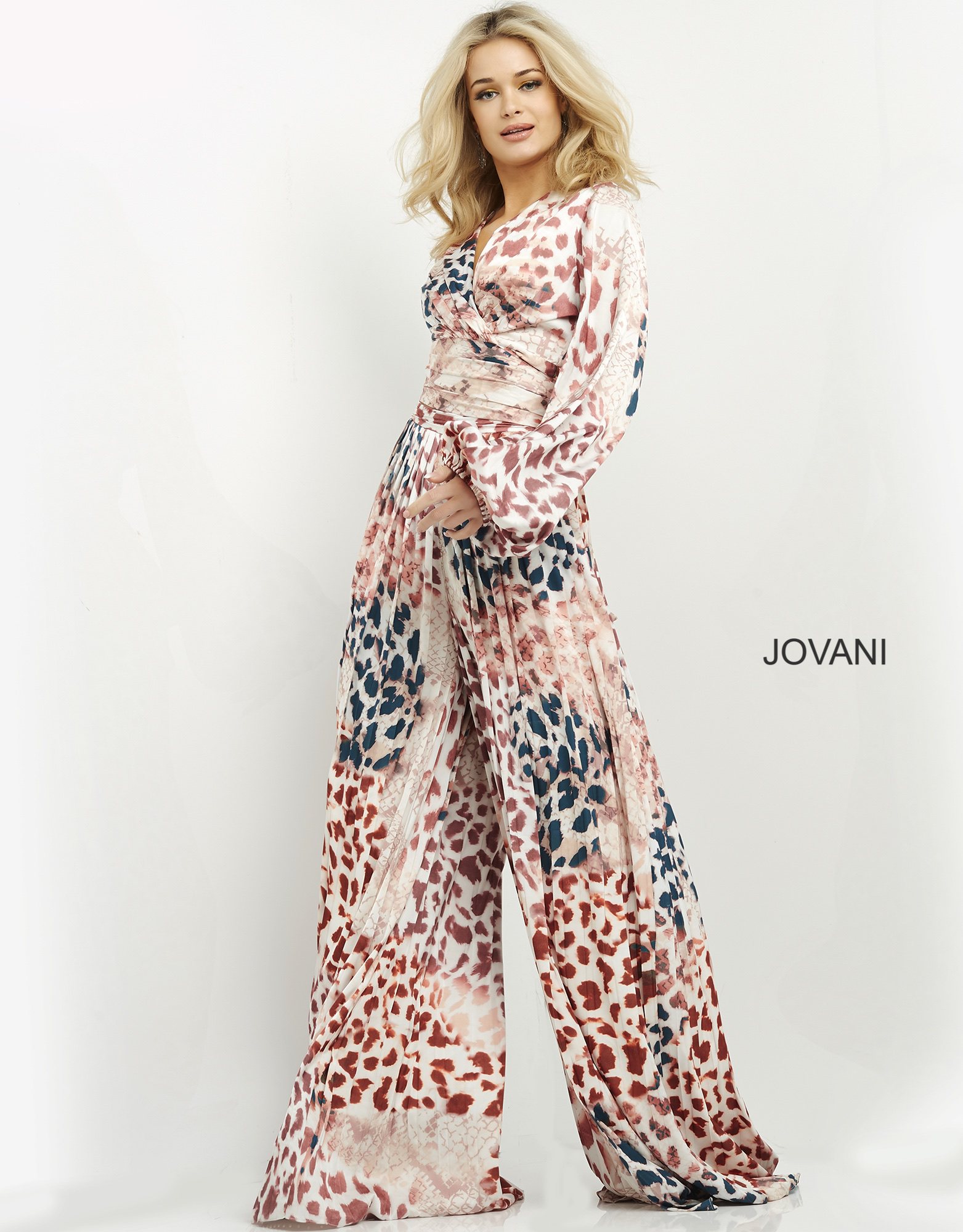 Model wearing Jovani 06846 dress full length in vibrant multi-color with V-neck.
