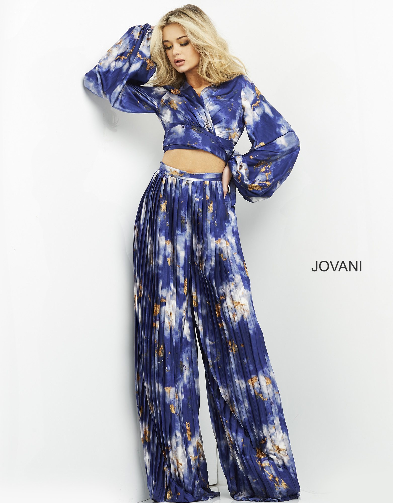 Jovani 06849 dress, model displaying V-neck and pleated skirt.
