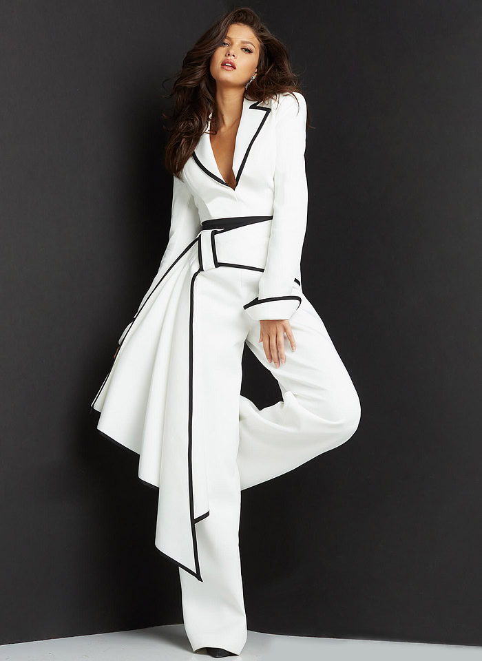 Model wearing Jovani 06917 white jumpsuit with black trim, front pose.