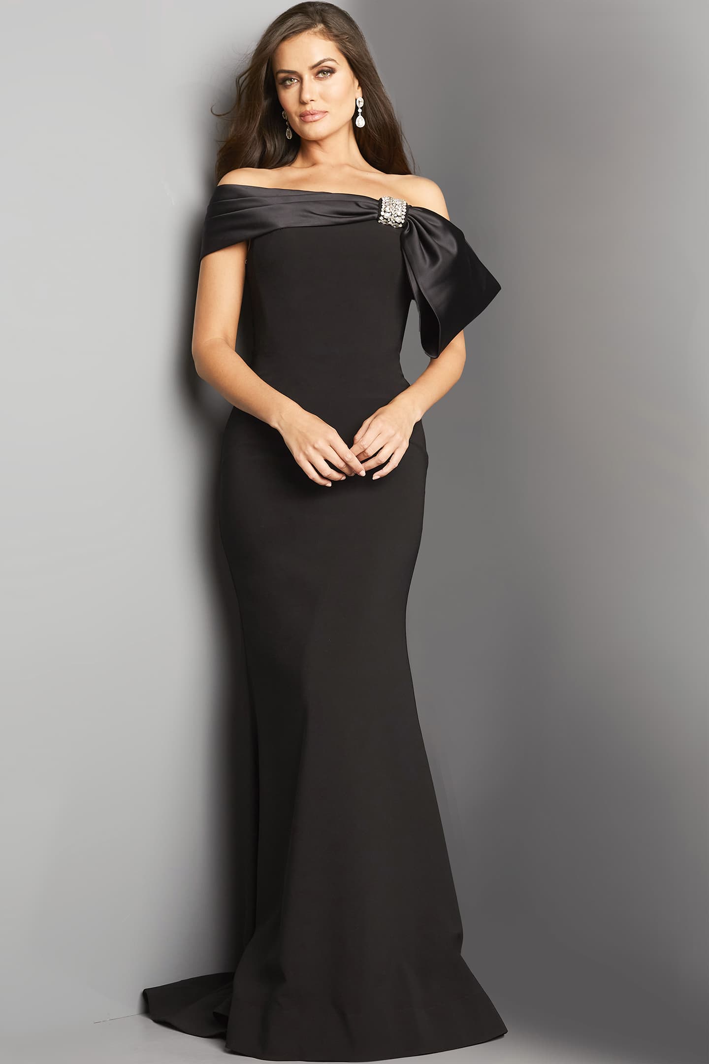 Model posing in Jovani 07014 black floor-length dress.