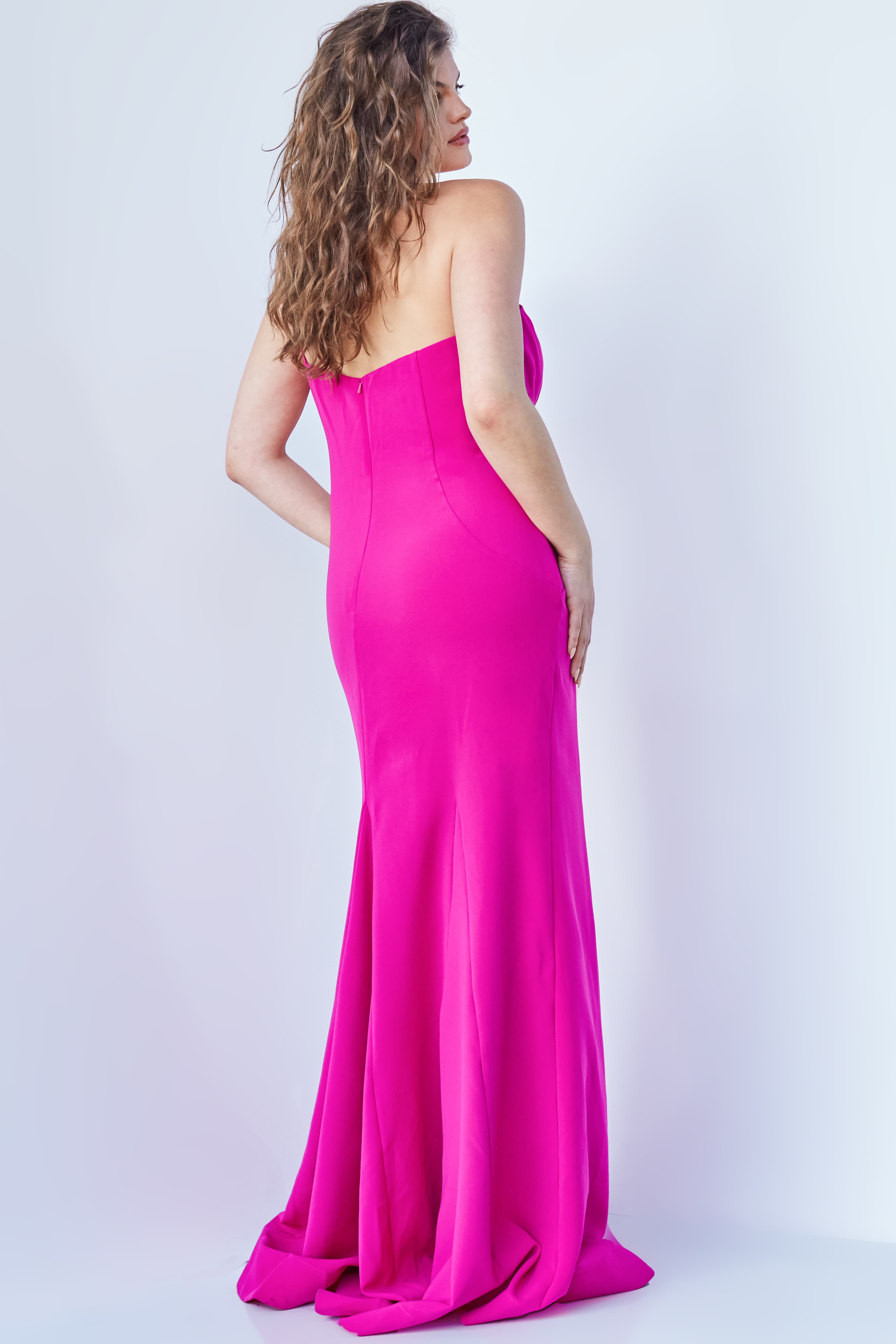 Model displaying Jovani 07306 fuchsia gown, front perspective with neckline and bow detail