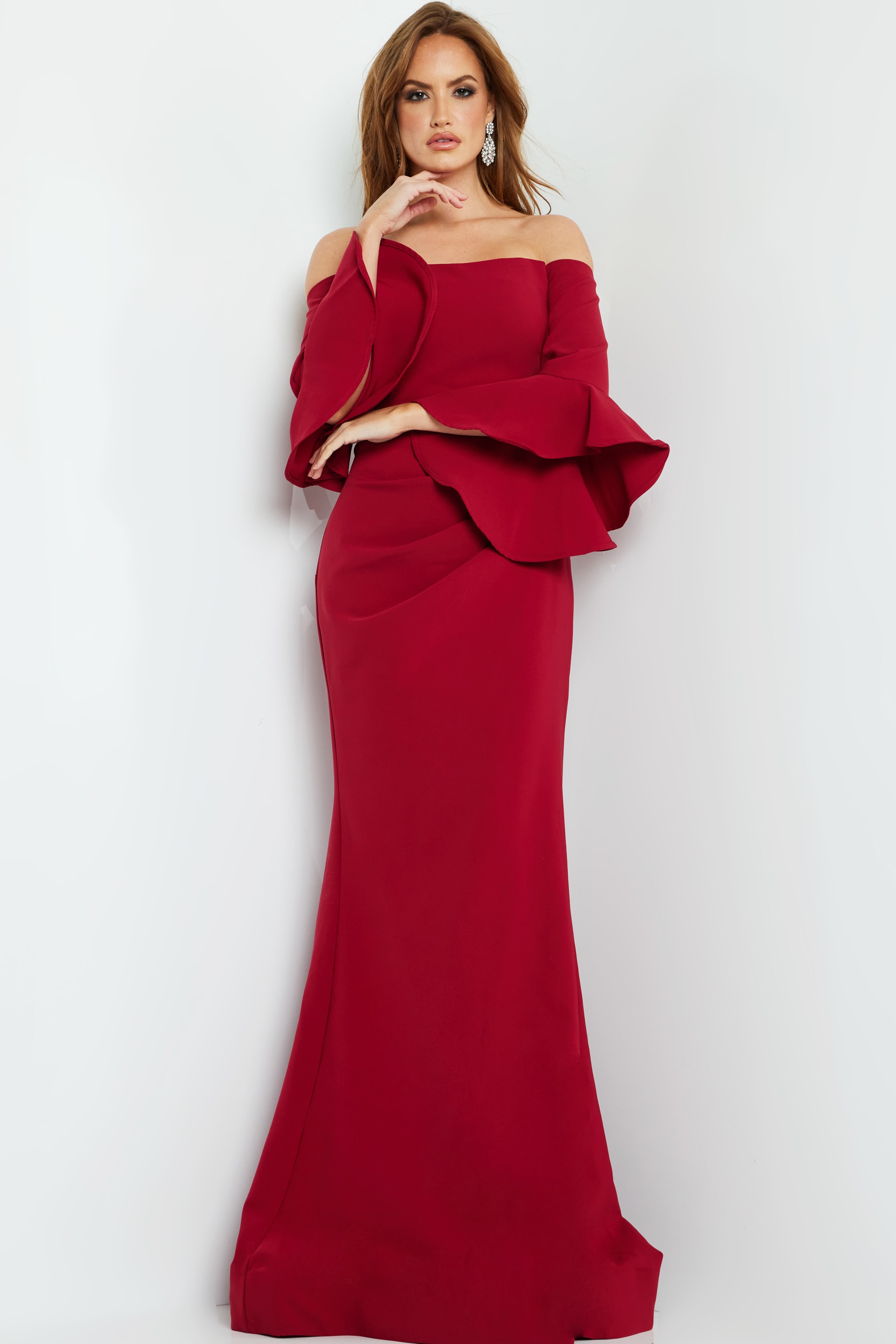 Model in Jovani 07065 cranberry gown, showcasing the off-the-shoulder neckline and elegant body-hugging fit.