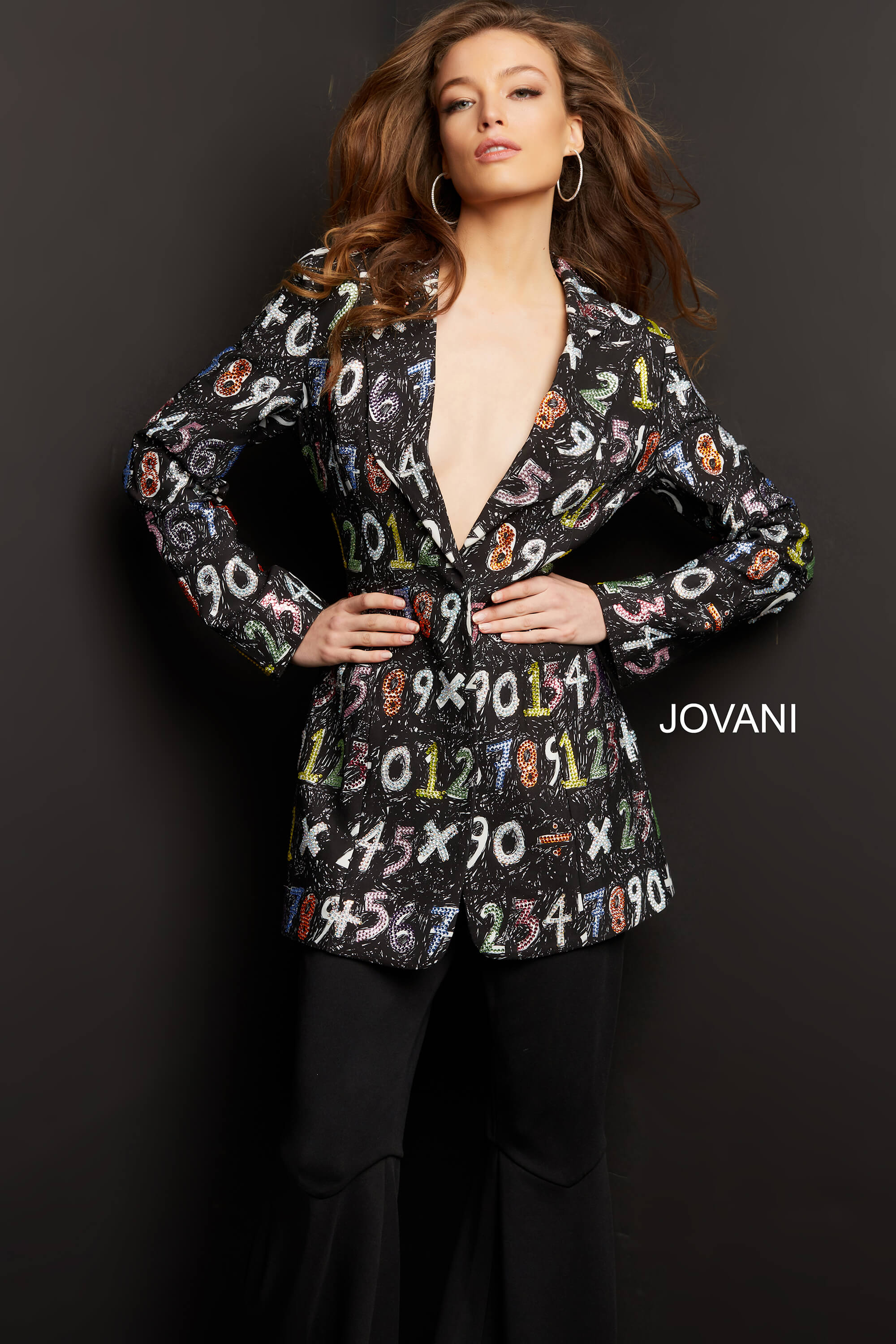 Wearing Jovani 07191 multi blazer dress, model with bold number design up close.