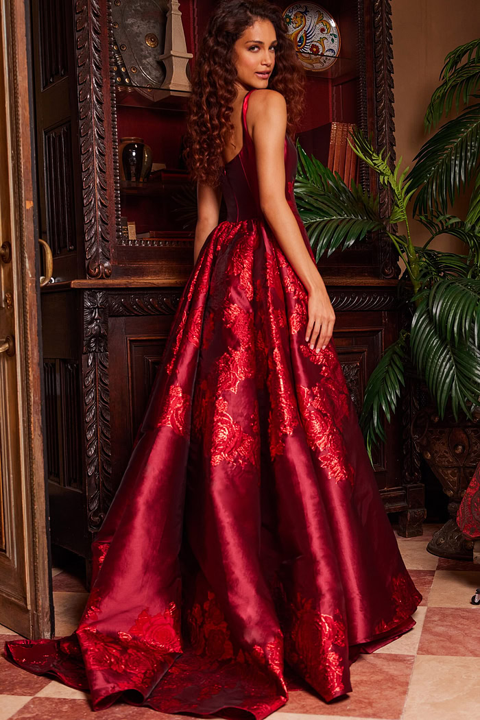 Model in Jovani 07441 purple gown from the back, highlighting the elegant silhouette and embroidery.
