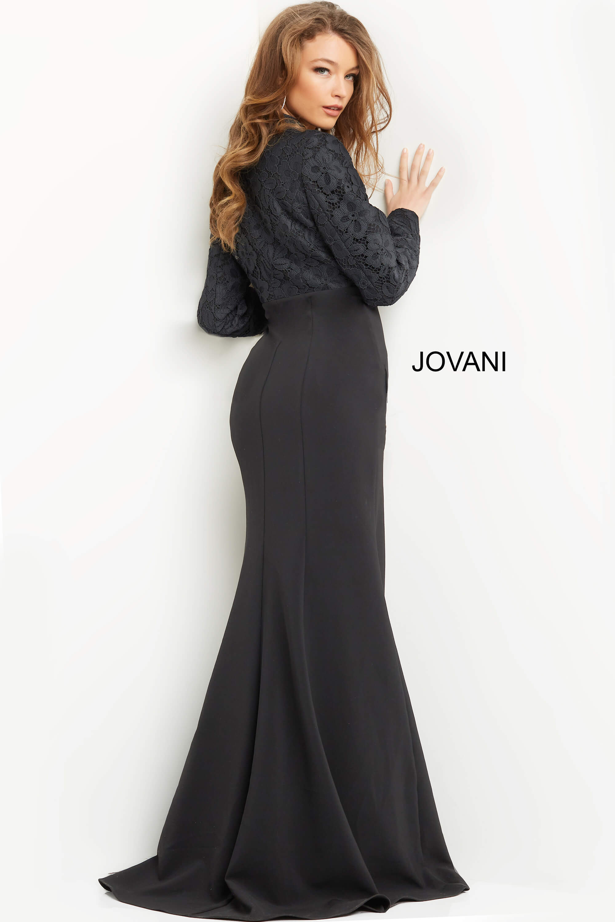 Back view of model wearing Jovani 07552 black dress with lace detailing.
