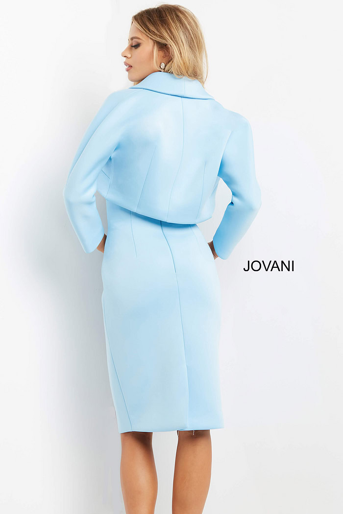 Model wearing Jovani 07556 light blue dress with back view of bolero.