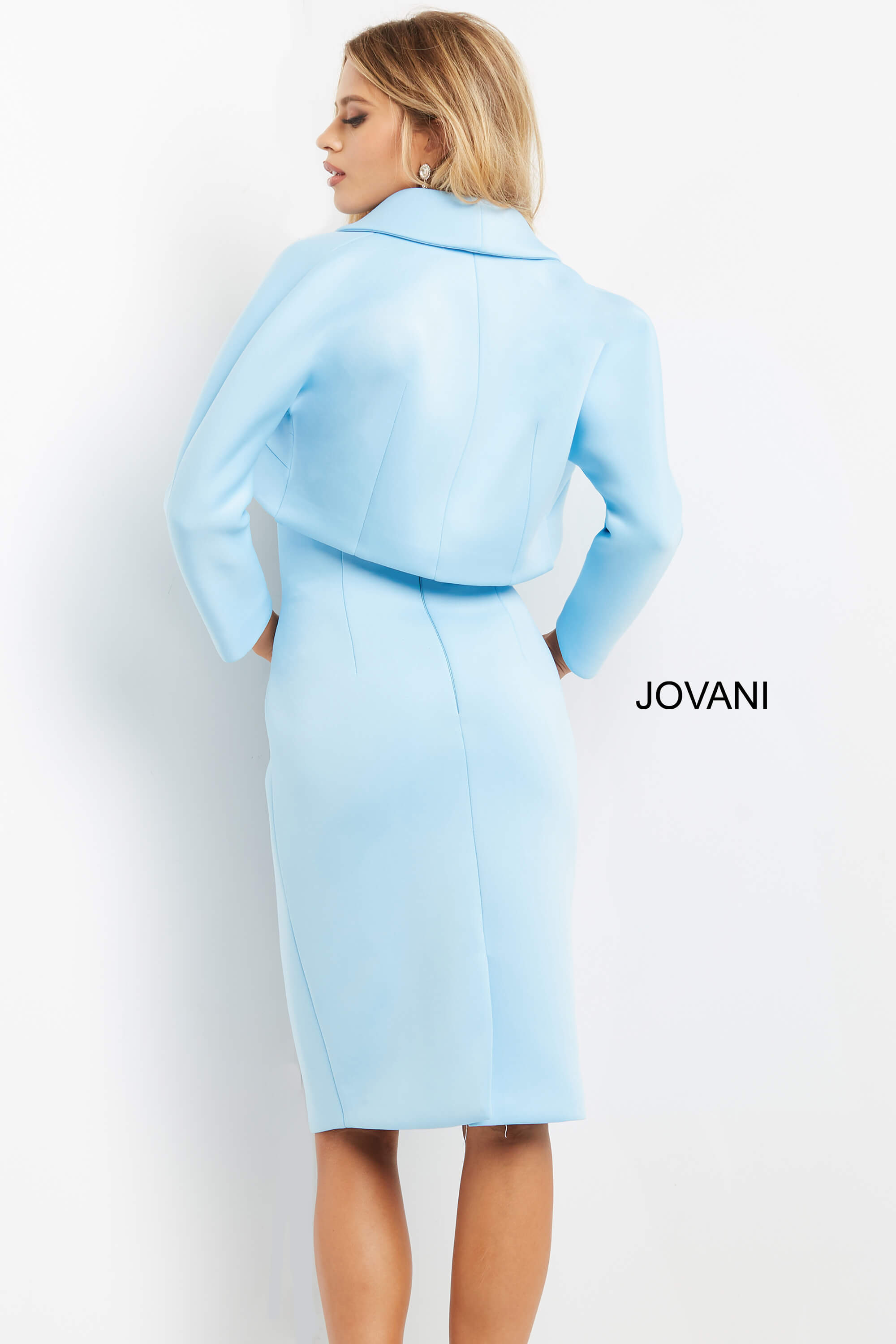 Model wearing Jovani 07556 light blue dress with back view of bolero.