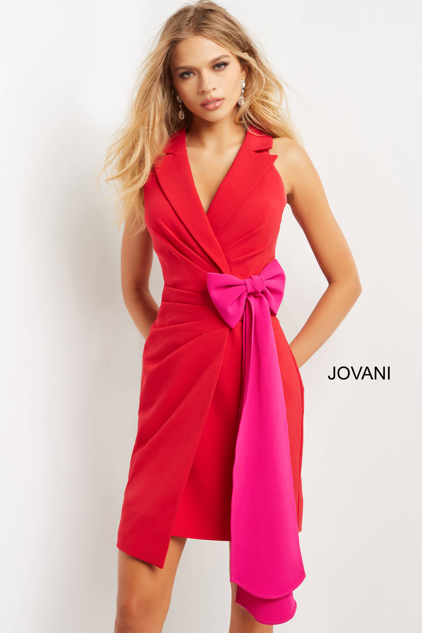 model wearing Jovani 07961 red dress with fuchsia bow detail, front view