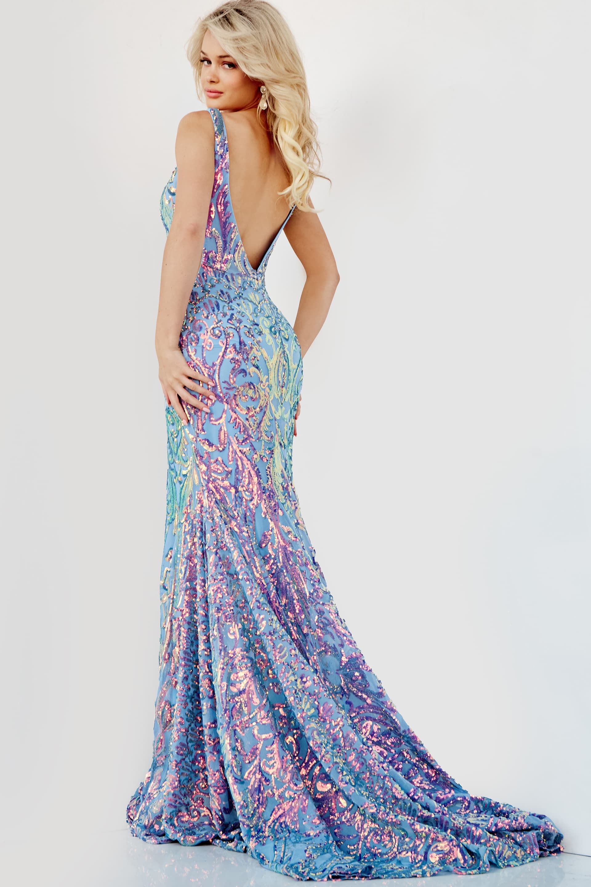 Model turns to showcase the Jovani 08099 dress