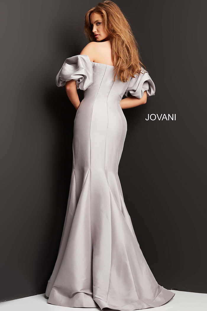 Back view of Jovani 08361 gown, highlighting mermaid silhouette and puff sleeves.
