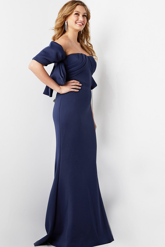 Side view of model wearing Jovani 09064 navy dress highlighting the silhouette.