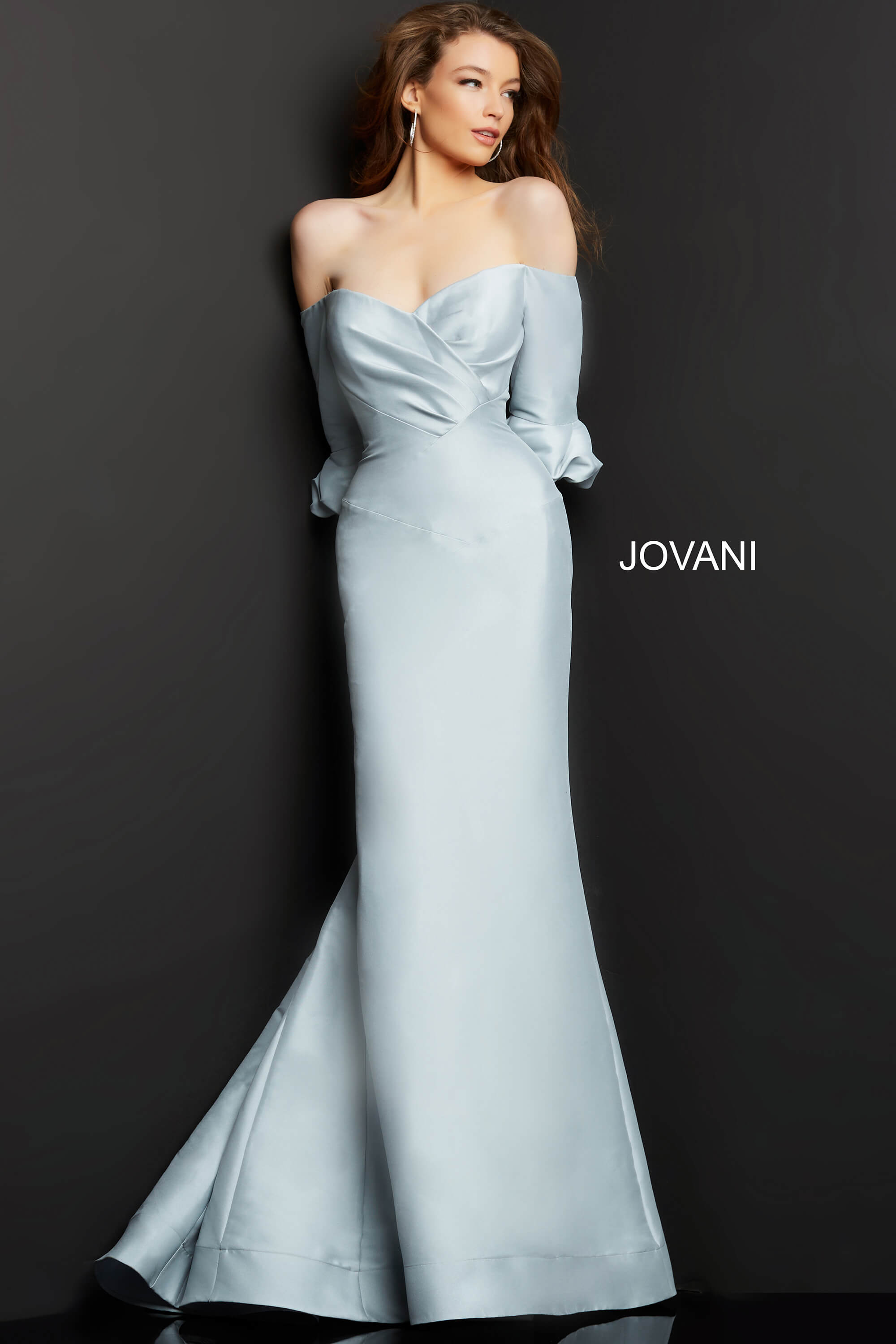 Model wearing Jovani 09420 silver dress, front view showcasing off-shoulder style