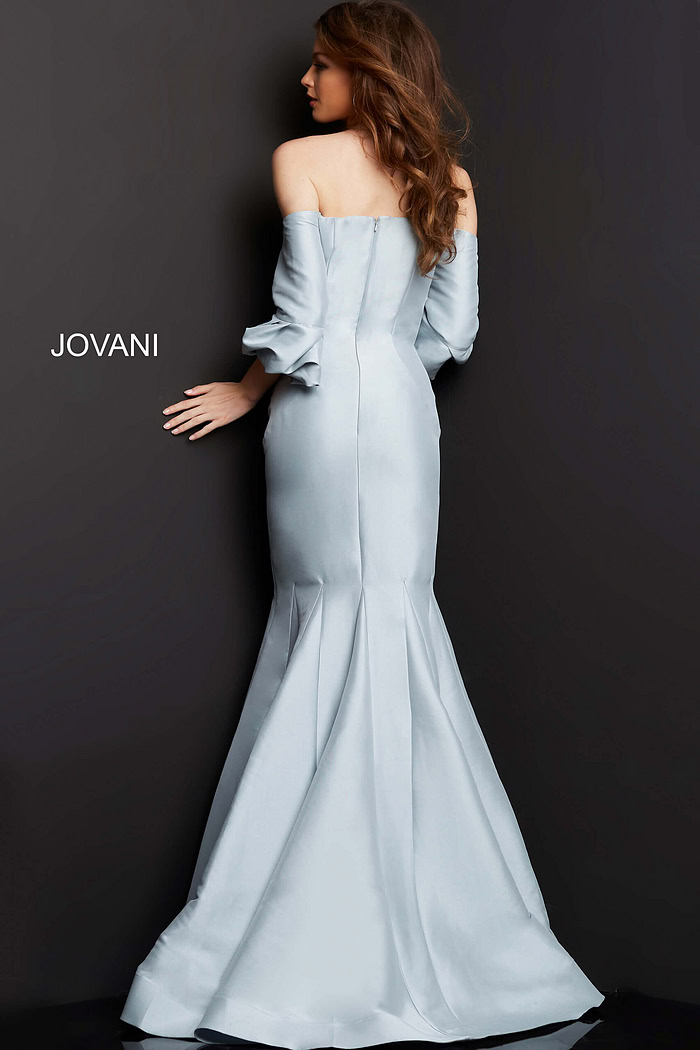 Model wearing Jovani 09420 silver dress, back view highlighting mermaid silhouette