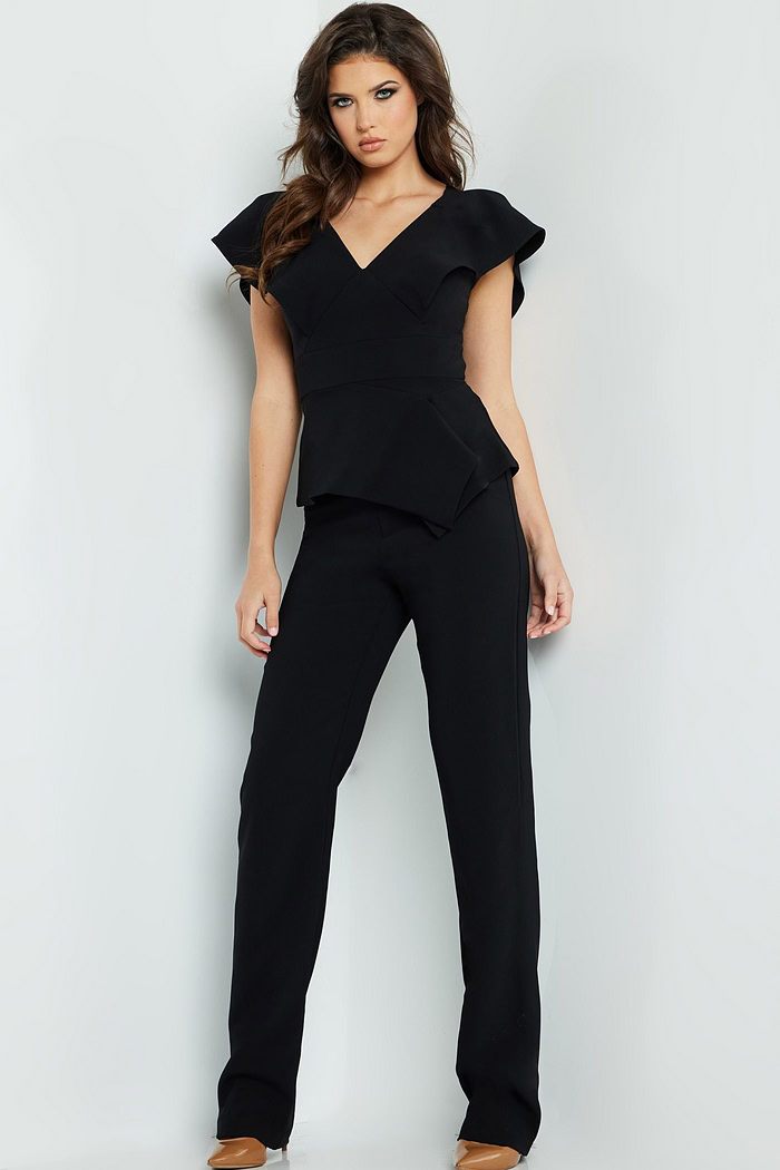 Model wearing Jovani 09646 in black, front view, full length V-neck jumpsuit.