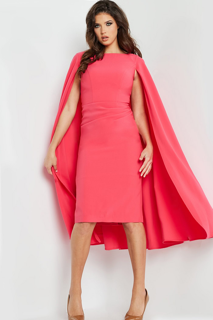 Model in Jovani 09756 red dress featuring dramatic cape sleeves in a fashionable stance.