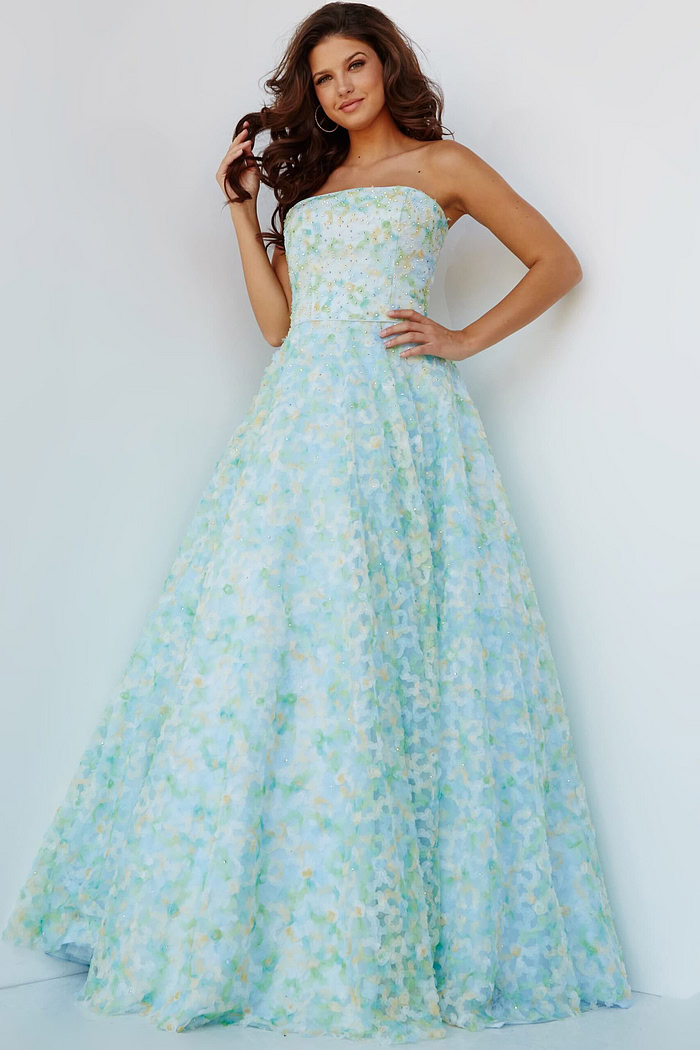 Model wearing K09765, front view of multi-colored A-line gown with strapless neckline and floral patterns.