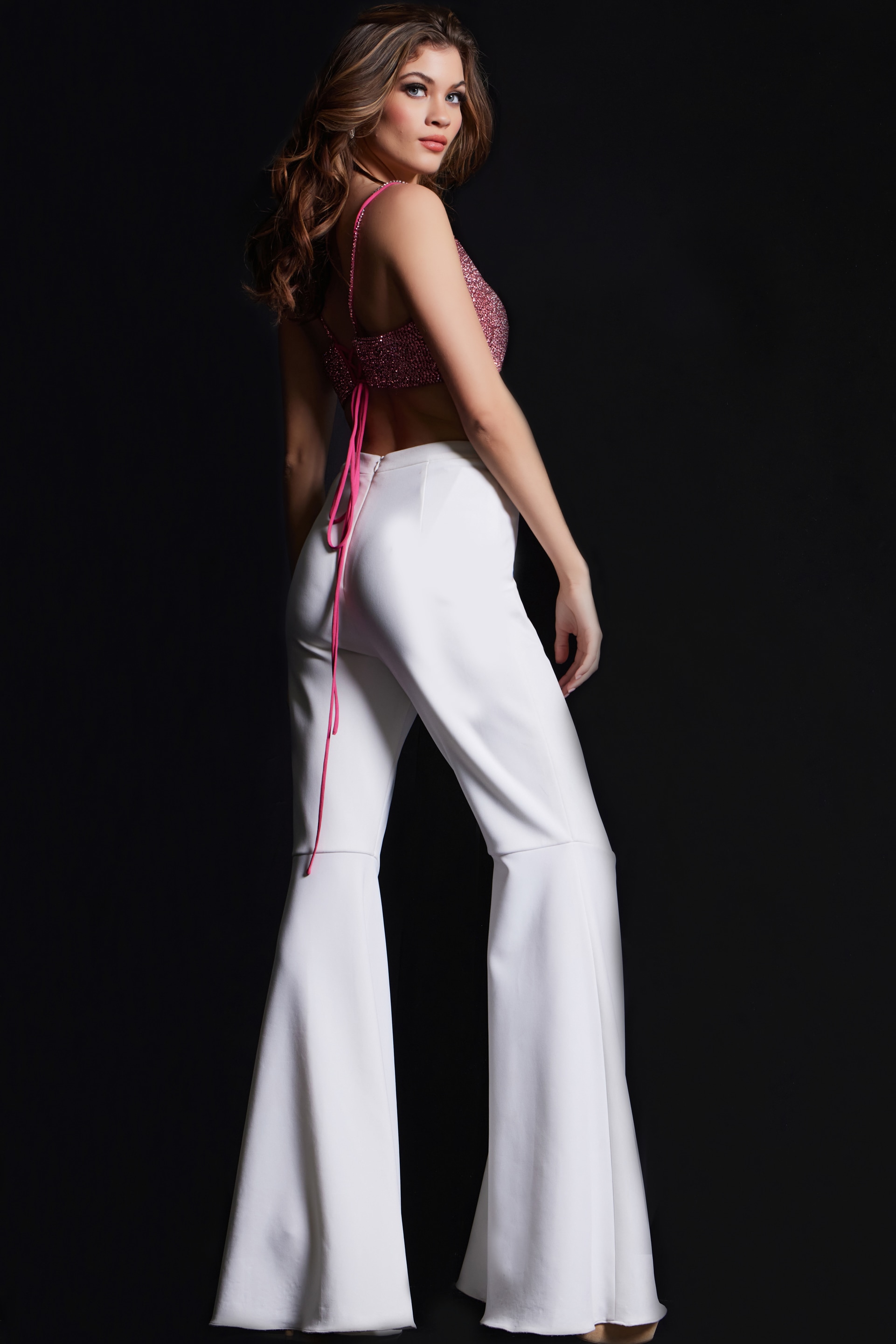Jovani 09836 side view of hot pink ensemble with flared trousers