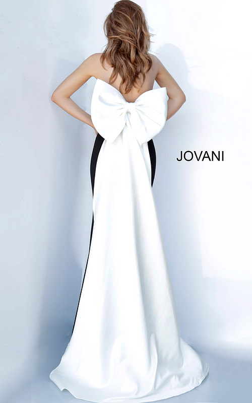 Back view of Jovani 12020 black gown with oversized bow detail