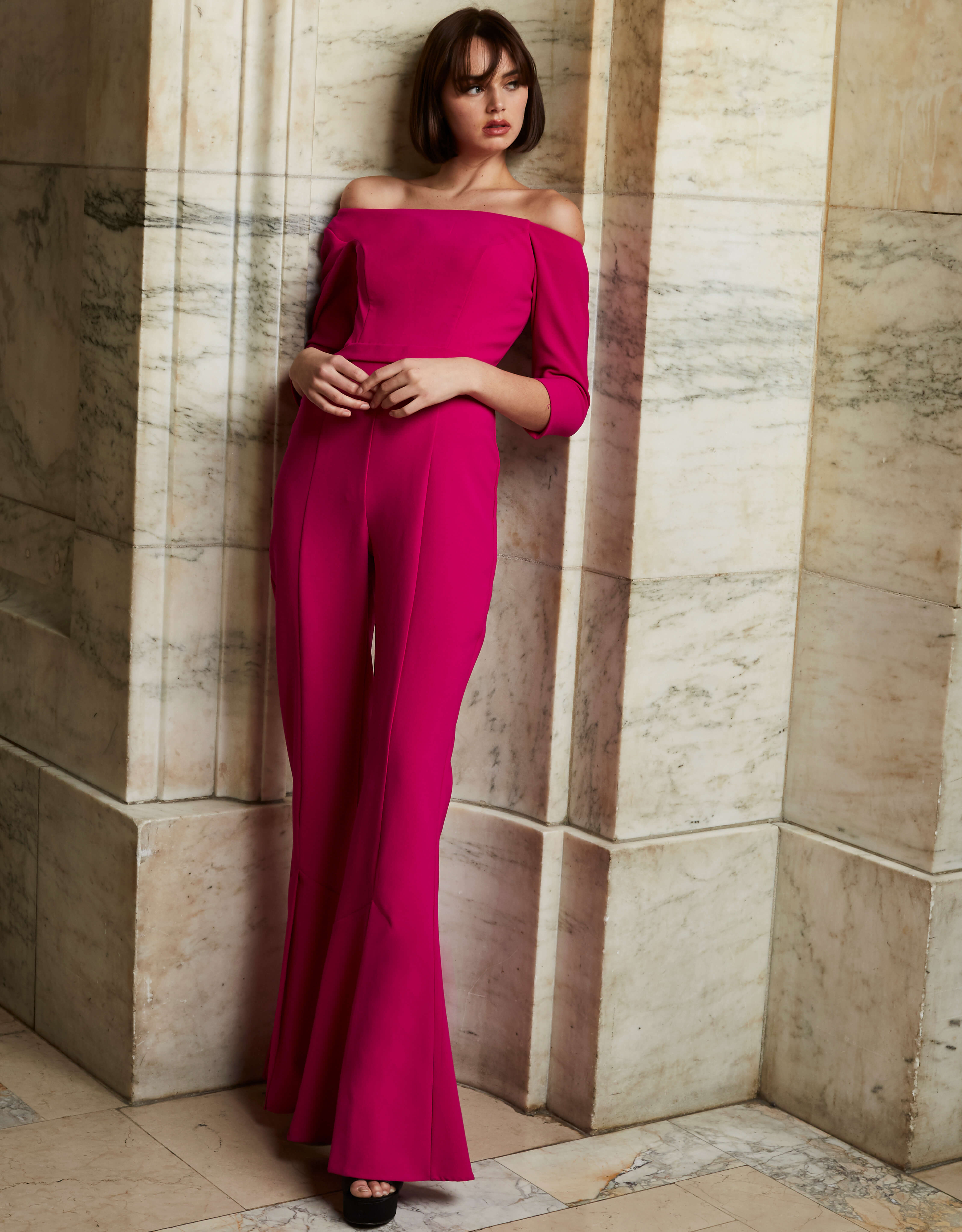 Elegant Jovani 1867 fuchsia jumpsuit featuring a wide-leg design.
