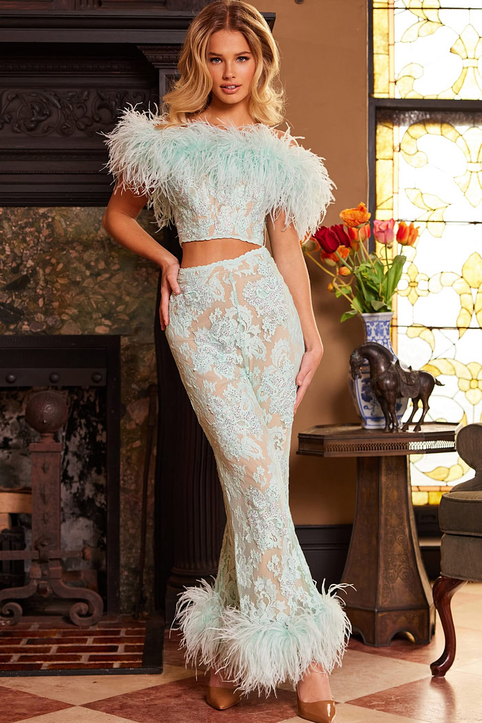 Model wearing Jovani 22350, front view showing elegant off-shoulder feathers and lace.