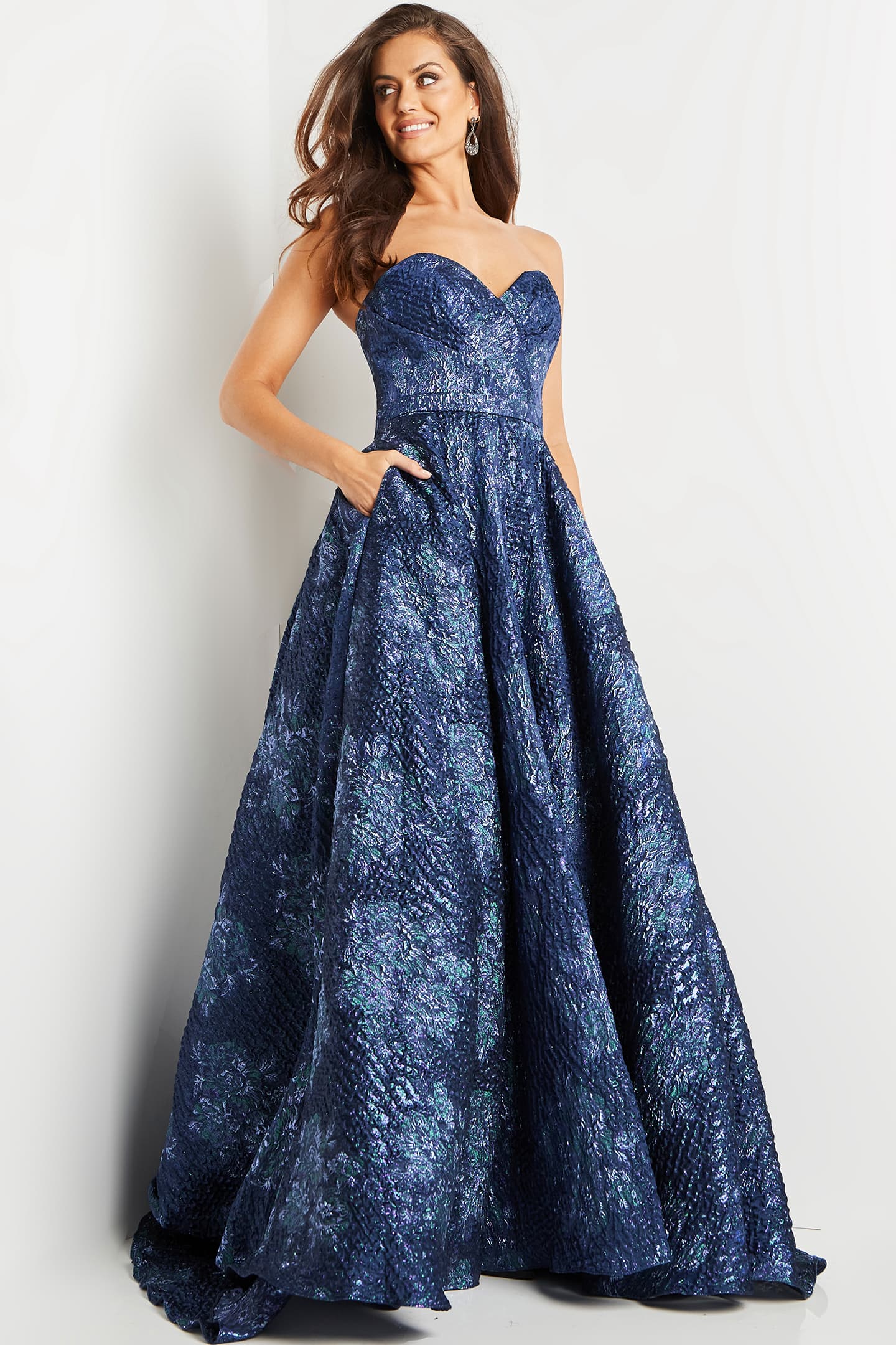 Model wearing Jovani 22792 navy gown with a front view in elegant pose.
