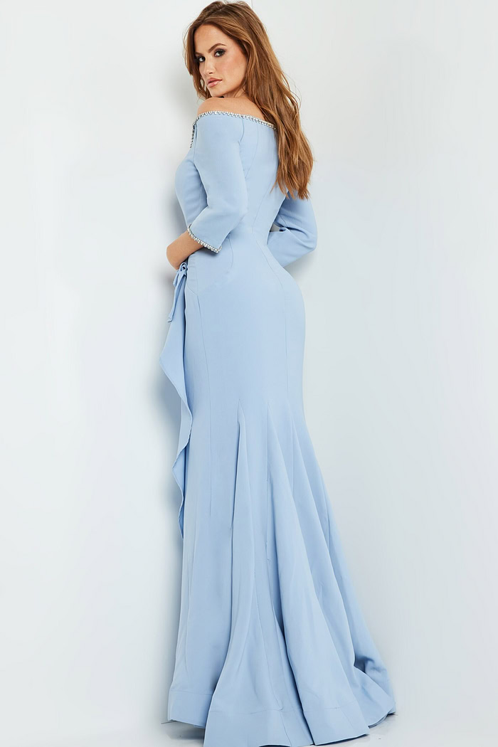 Back view of model wearing Jovani 23190 in light blue, highlighting elegant draping and fitted mermaid style.