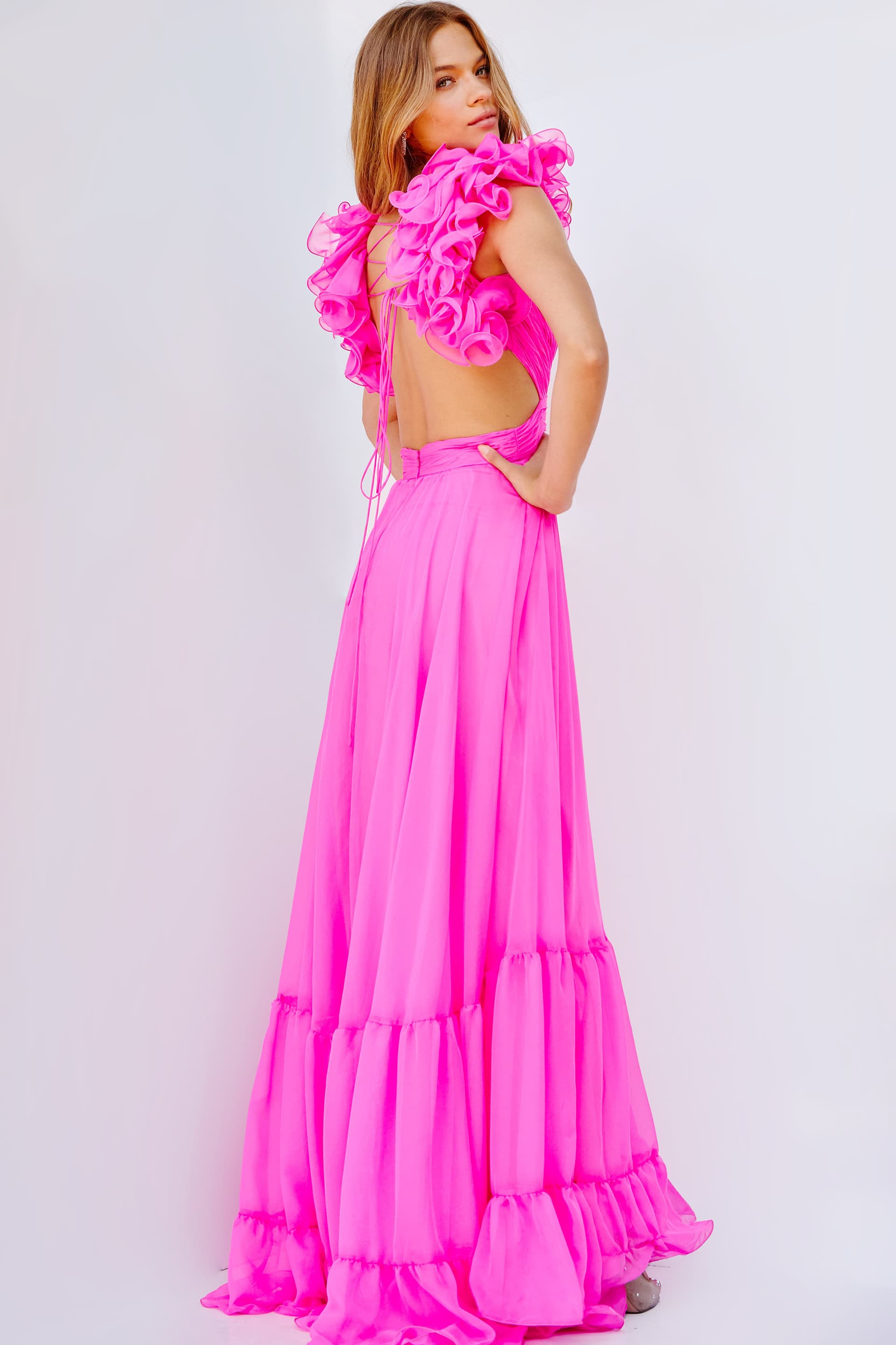Back view of model wearing Jovani 23322 hot pink dress with floral details