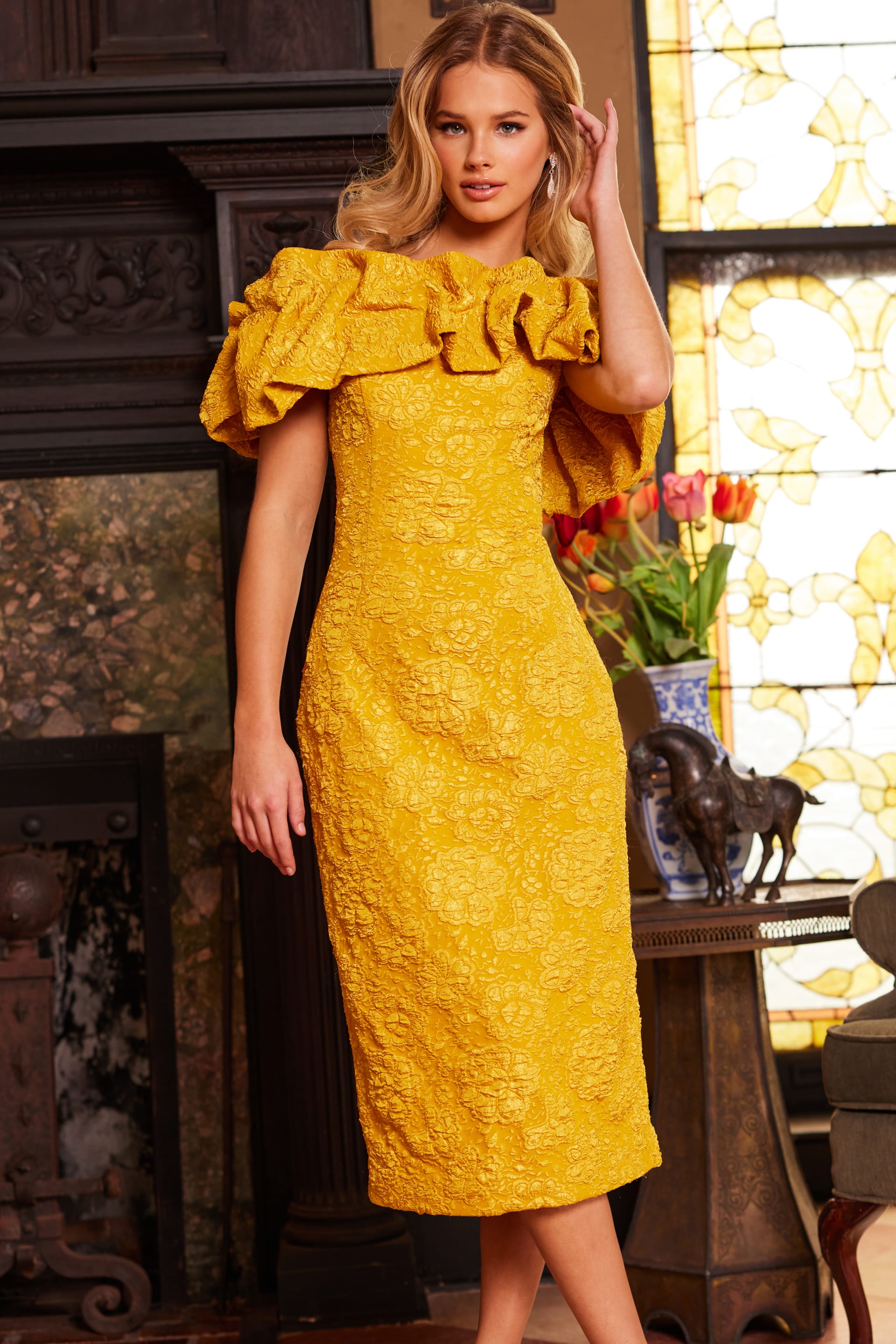 Model in Jovani 23848 yellow dress, detailed look at the off-the-shoulder ruffles.