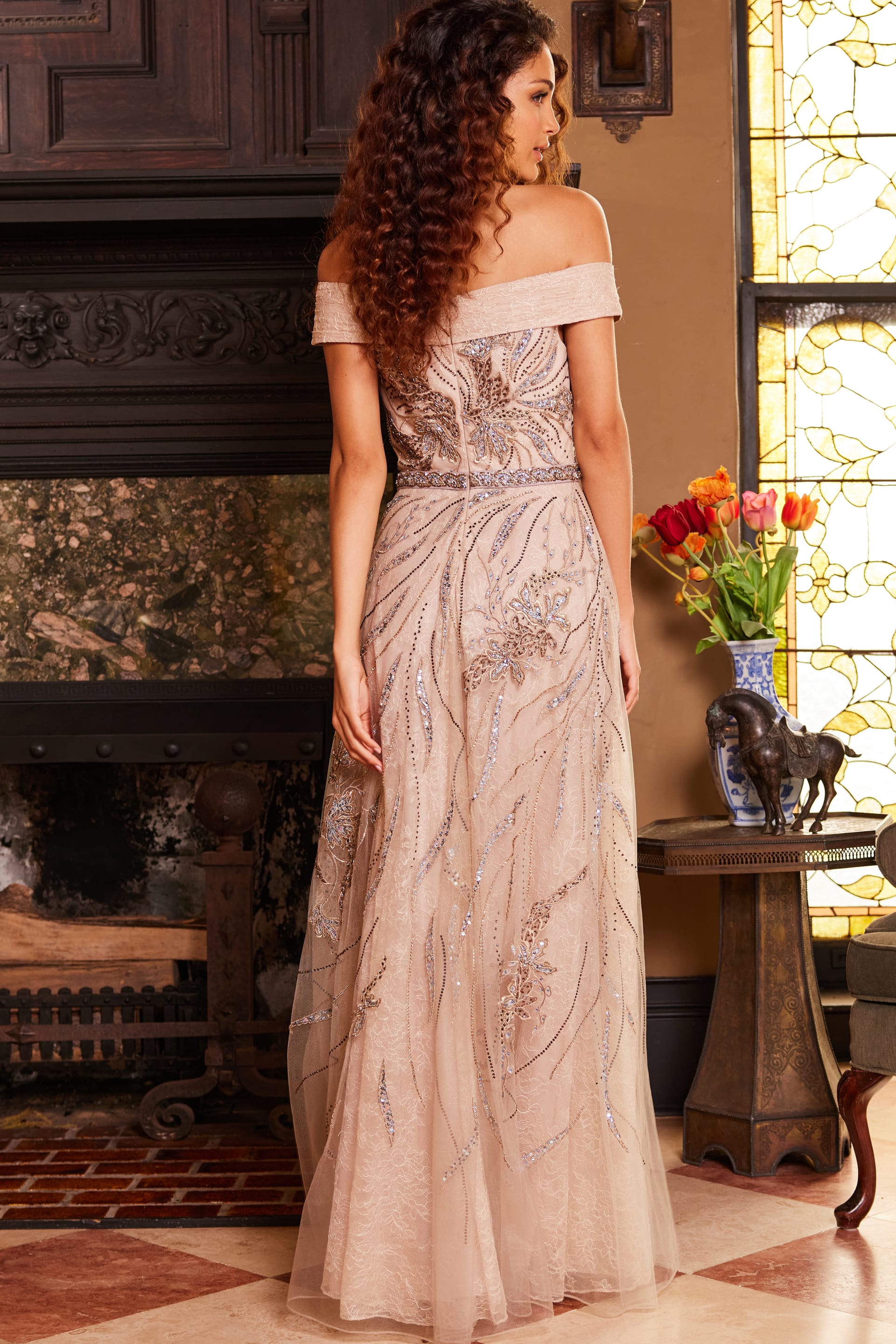 Back view of Jovani 24055 beige dress, featuring off-the-shoulder neckline and intricate embroidery.