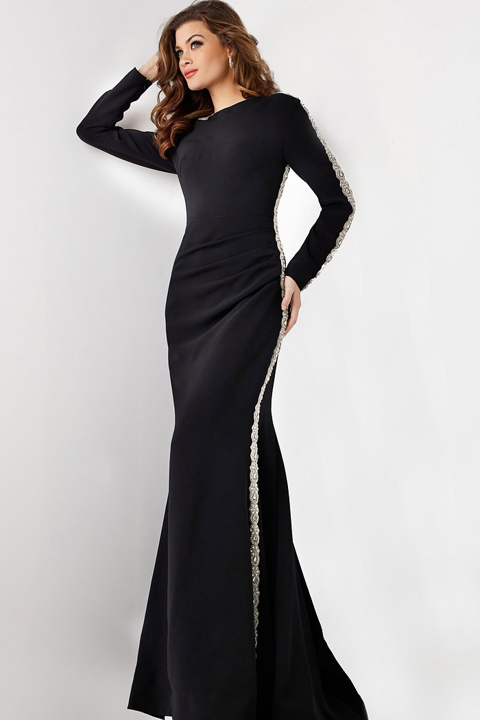 model wearing Jovani 24191: black mermaid gown with silver embellishment, side view