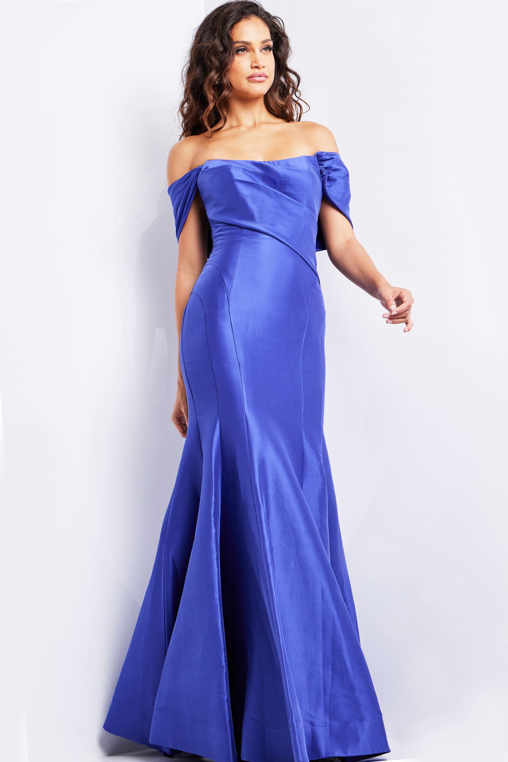 model wearing Jovani 24283 purple off-the-shoulder mermaid silhouette dress, front view