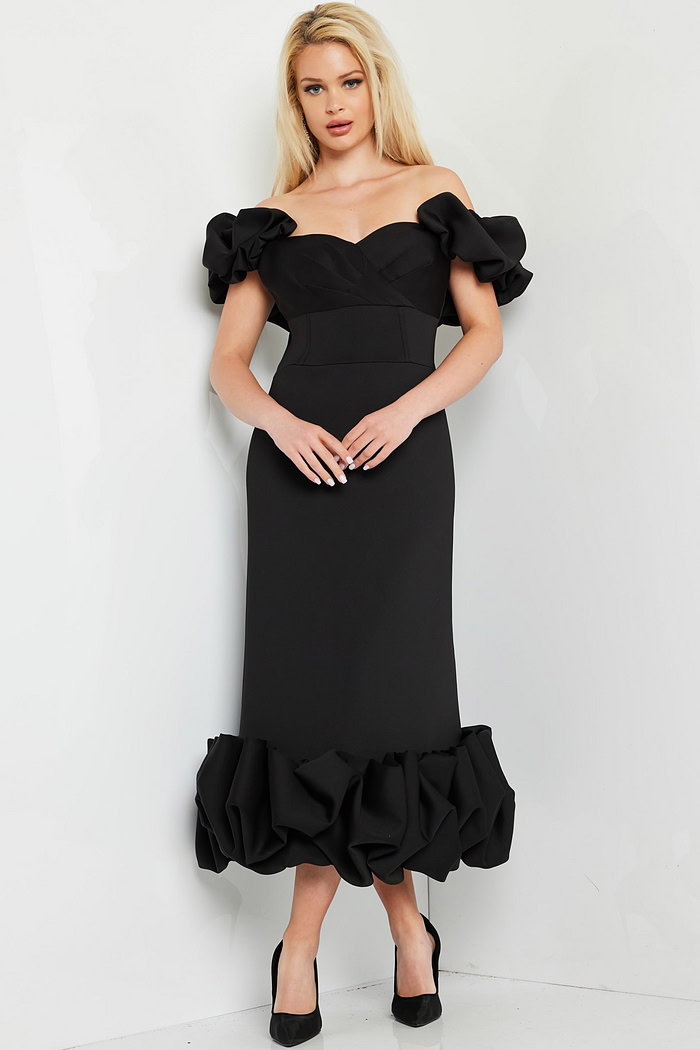 model wearing Jovani 24535 black dress with ruffled sleeves and hem, front view
