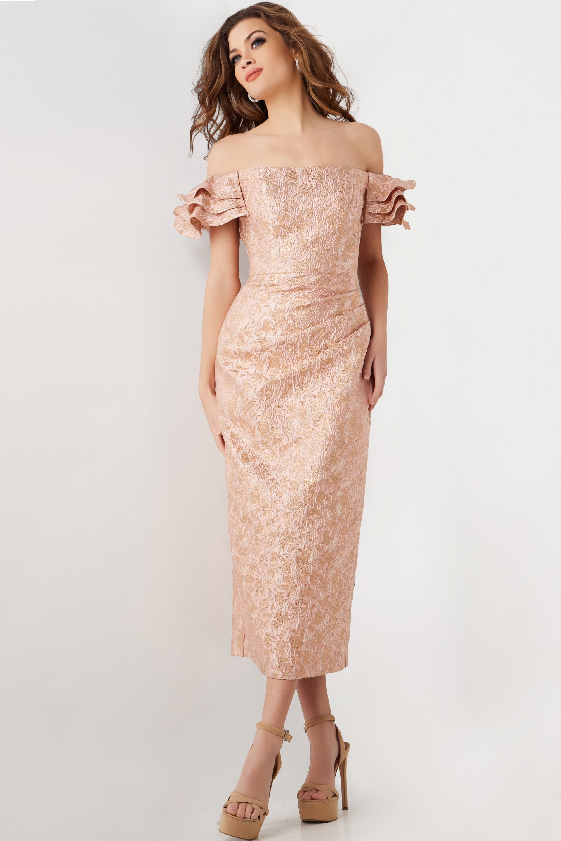 Model wearing Jovani 25667 pink off-the-shoulder midi dress with ruffled sleeves, showcasing the elegant design.