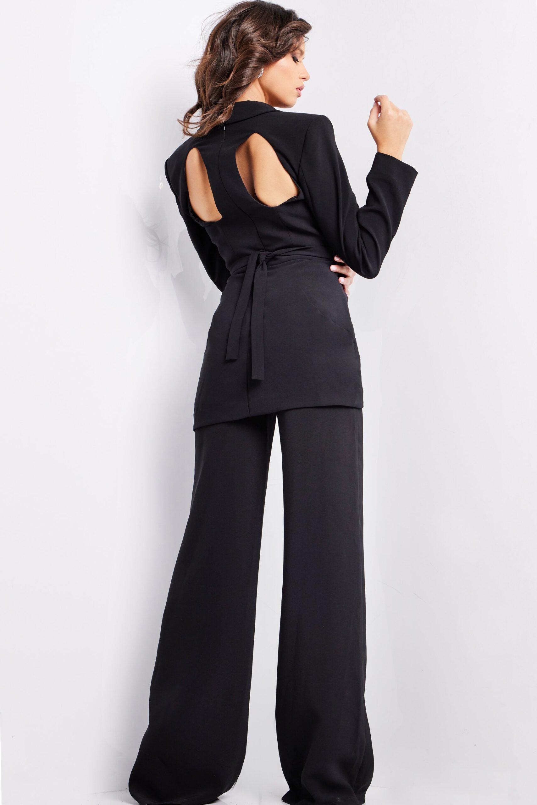 Back view of model in Jovani 25743 ensemble with wide-leg pants and elegant design.