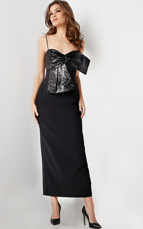 Model wearing Jovani 25745 elegant black dress with sequin bow detail and sweetheart neckline.