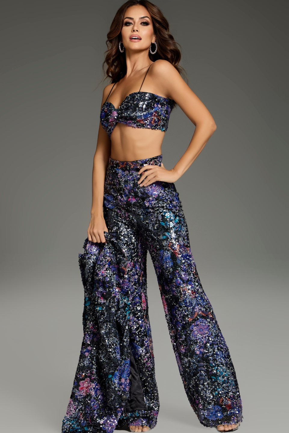 Model wearing Jovani 25750 multi-colored sequin crop top and wide-leg pants