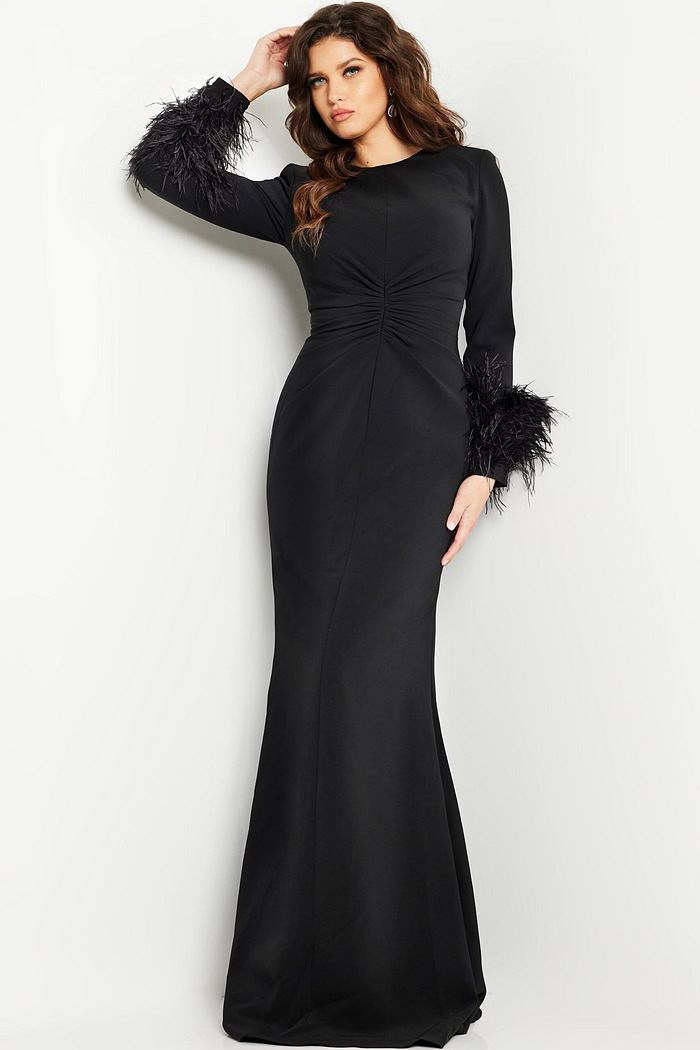 Model wearing Jovani 25898 black gown showcasing elegant silhouette and intricate design, front view.