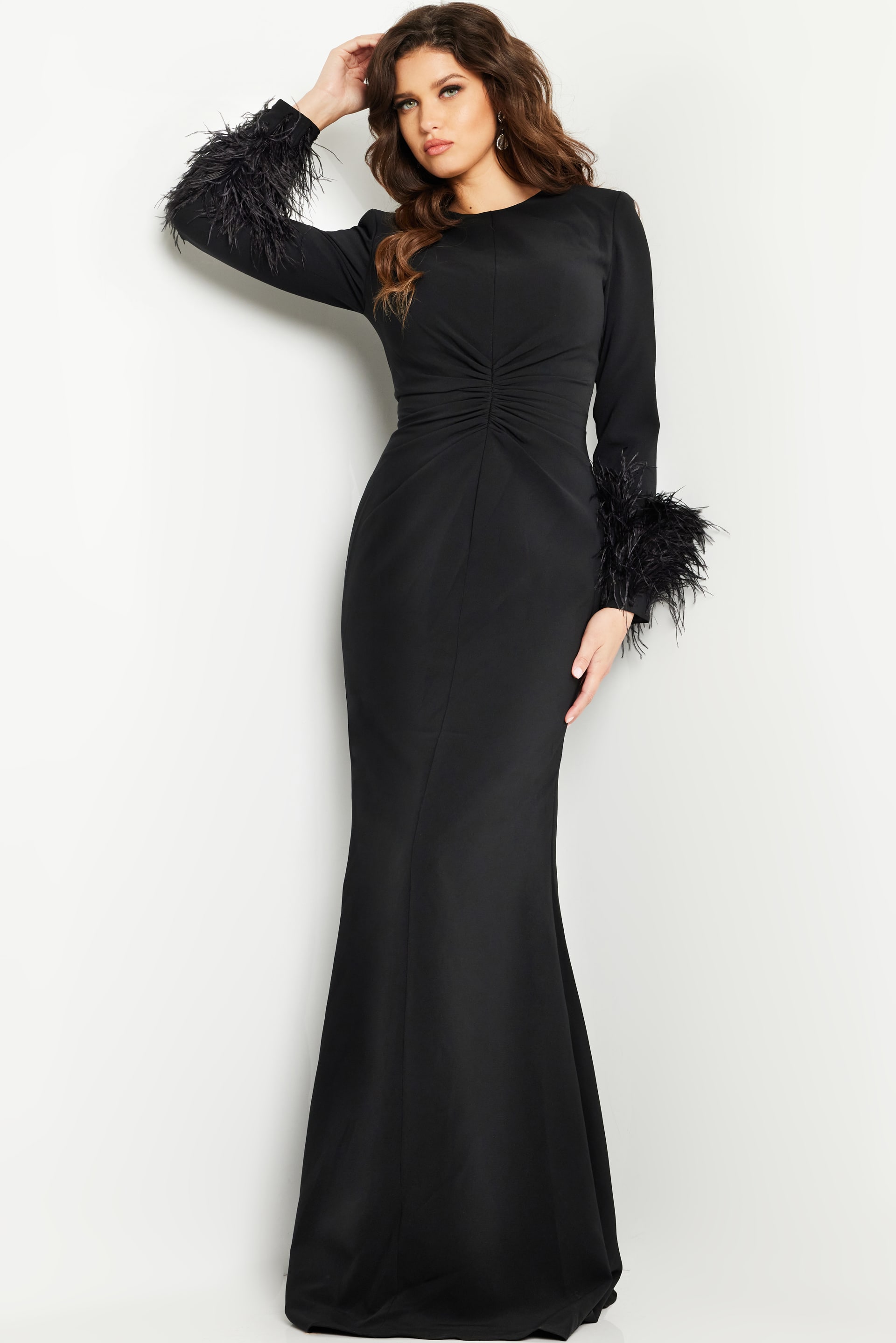 Model wearing Jovani 25898 black gown showcasing elegant silhouette and intricate design, front view.